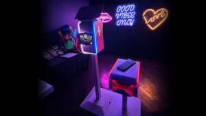 custom neon sign backdrop with our white venture photo booth in Fort Myers, florida